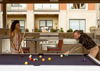 Couple playing pool indoor